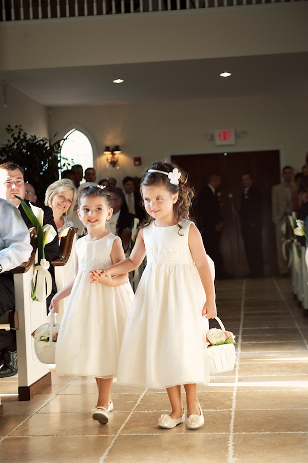 little flower girls walking down the isle photo by Houston based